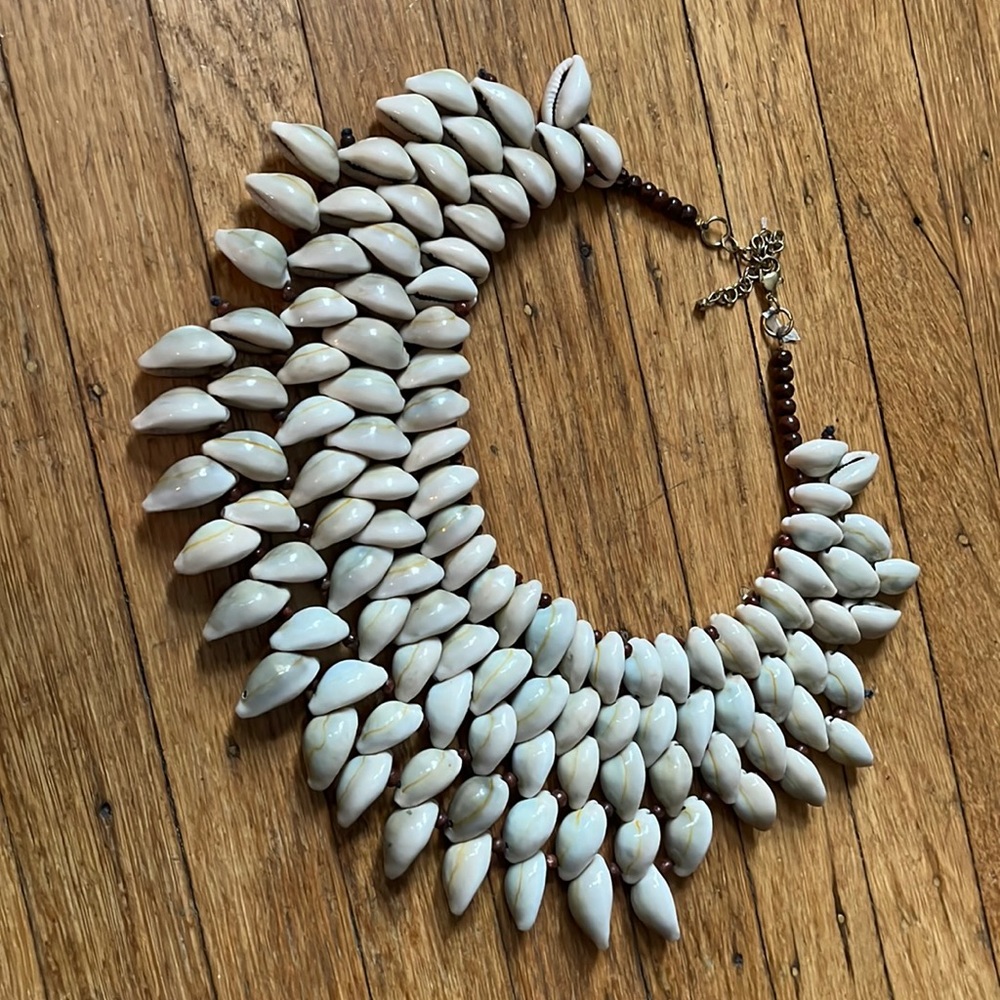 Woven cowrie shell statement necklace.